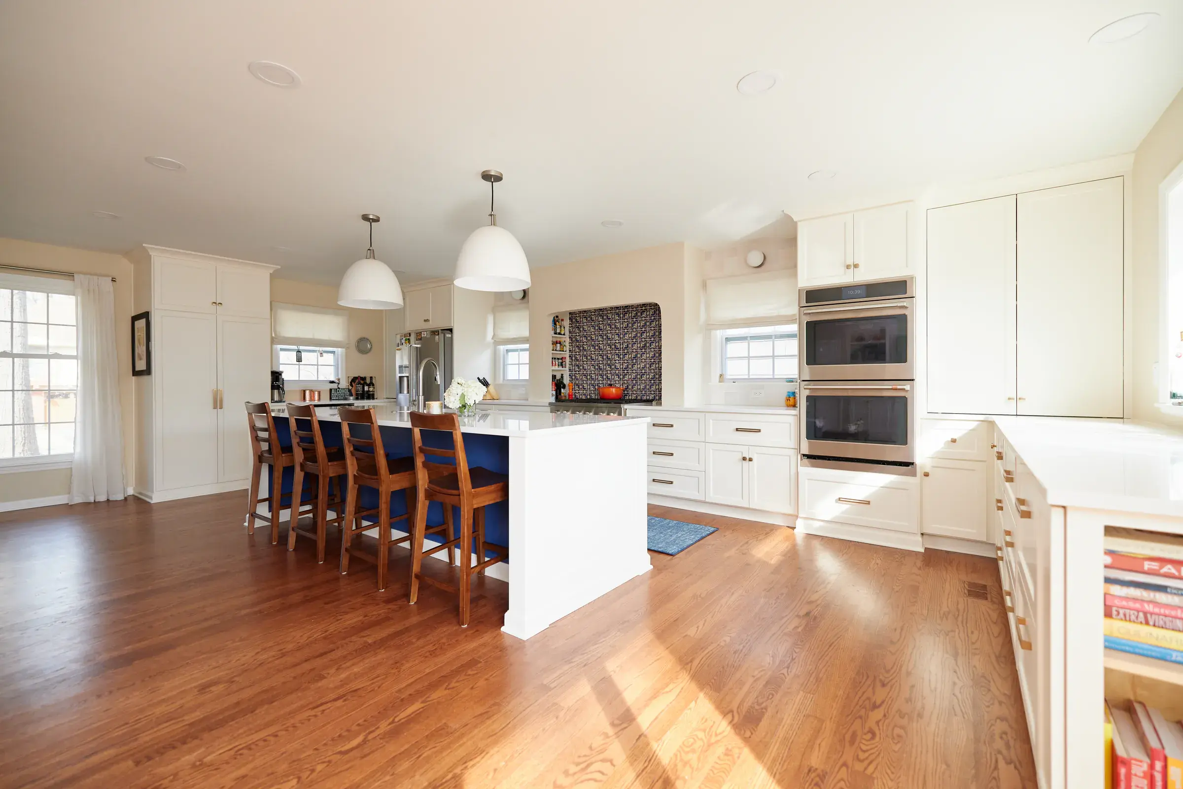 Richly finished hardwood floors throughout a bright open kitchen